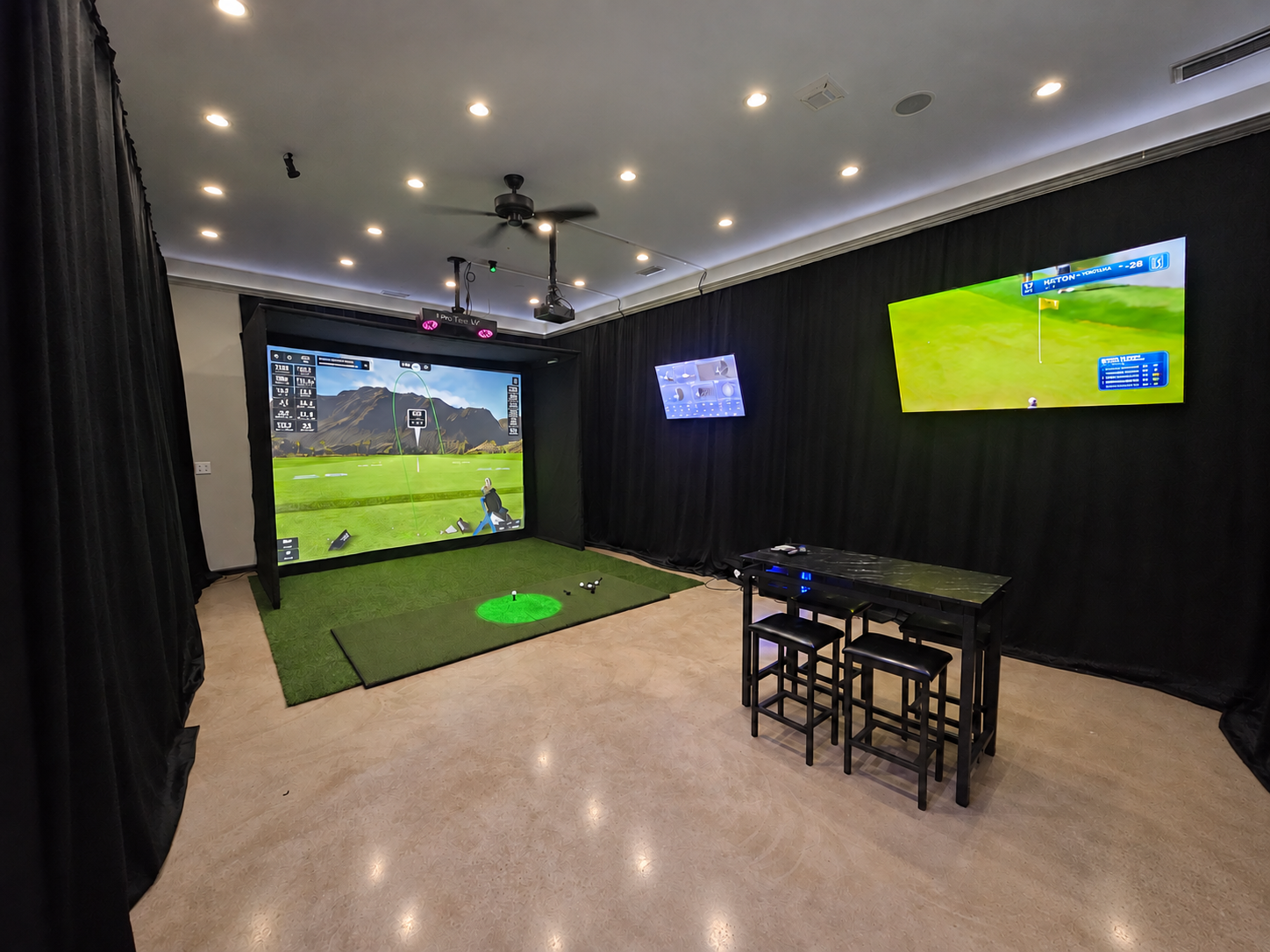 BAY 1 at Mulligan Bay Golf, with its ProTee VX simulator, hitting area, TVs and seating.