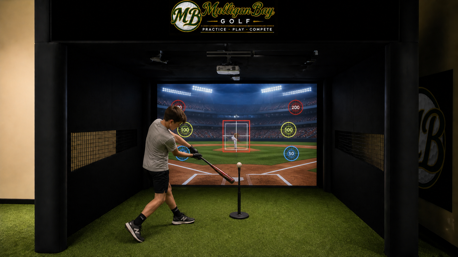 A player swinging a baseball bat toward an interactive game in the Bay 3 enclosure